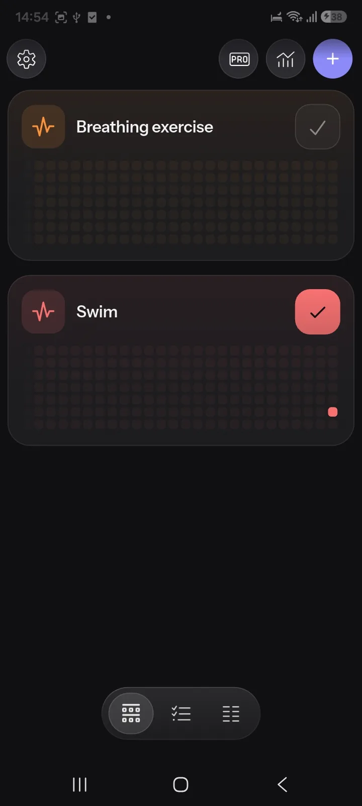 HabitKit home screen showing two habits as grids of daily tiles